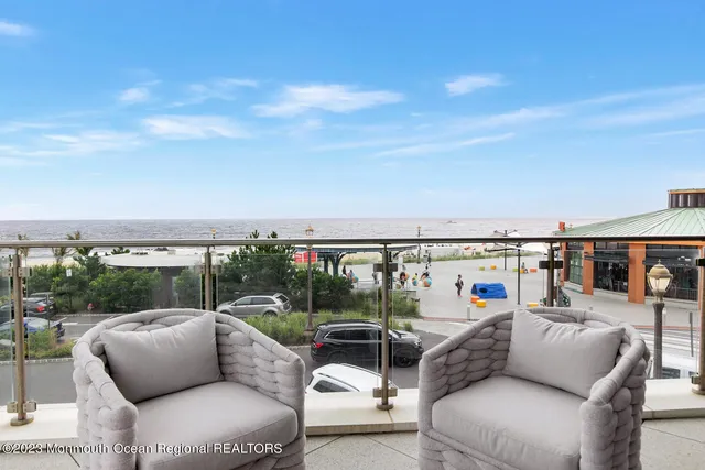 a balcony with furniture and city view