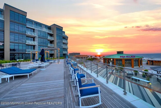 a front view of a building with a garden