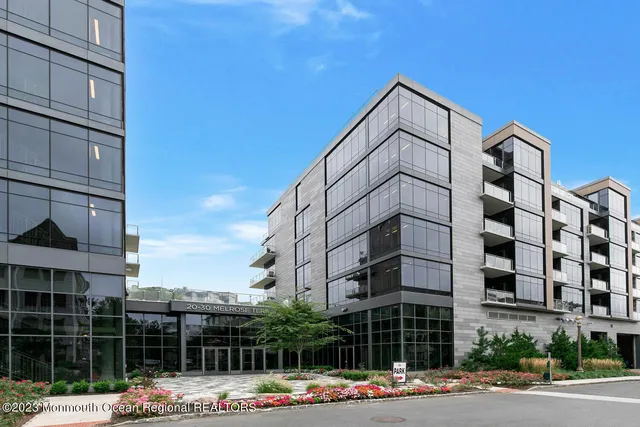 a bedroom with a bed and a shower