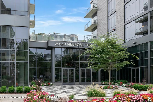 a living room with furniture and air conditioner