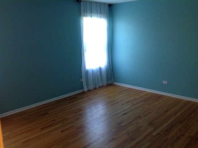 1808 Hatch Street Downers Grove, IL 60516 - Photo 14 of 20 an empty room with wooden floor and windows