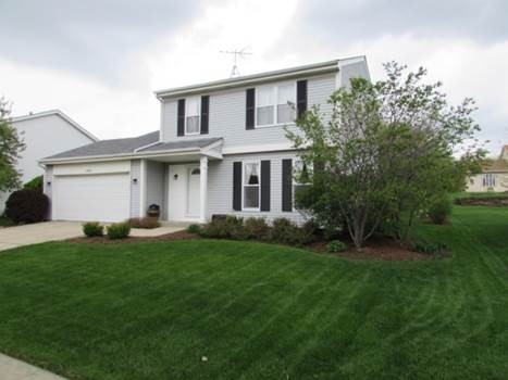 1808 Hatch Street Downers Grove, IL 60516 - Photo 2 of 20 a front view of a house with a garden