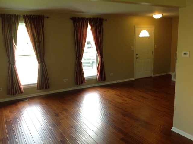 1808 Hatch Street Downers Grove, IL 60516 - Photo 3 of 20 an empty room with wooden floor and windows