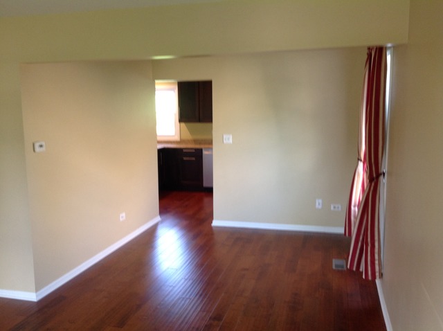 1808 Hatch Street Downers Grove, IL 60516 - Photo 6 of 20 a view of a hallway with wooden floor and staircase
