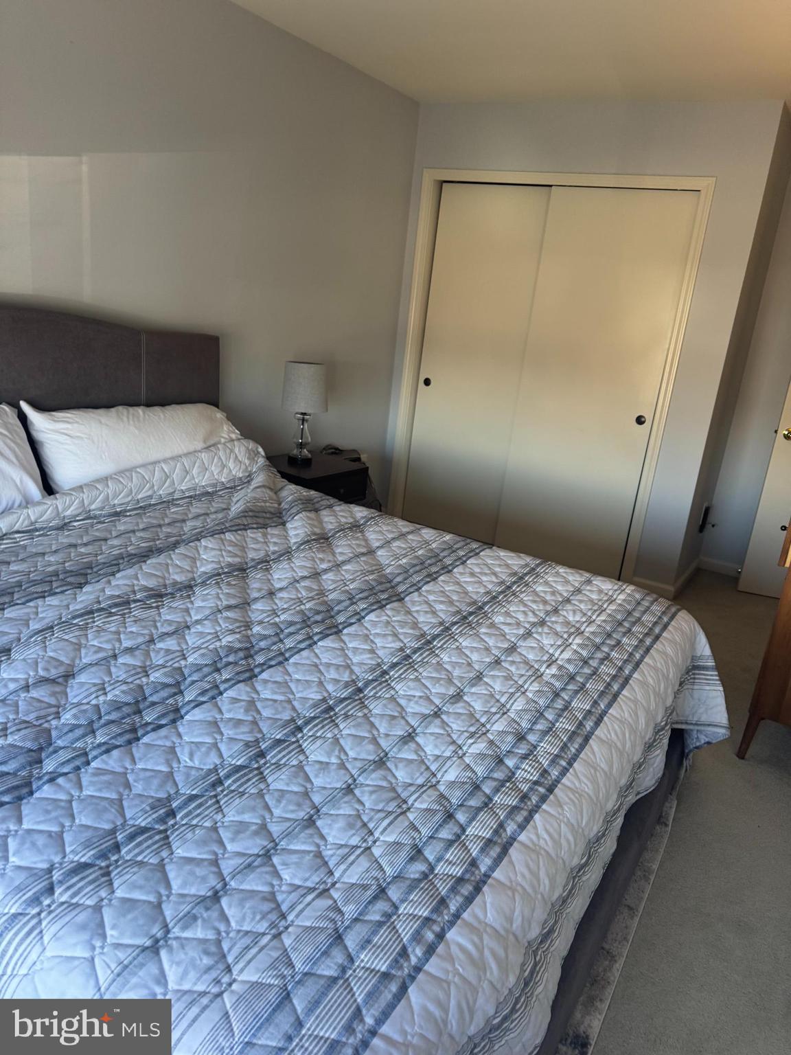 43 Poplar Street Glassboro, NJ 08028 - Photo 12 of 16 a bedroom with a bed and a lamp