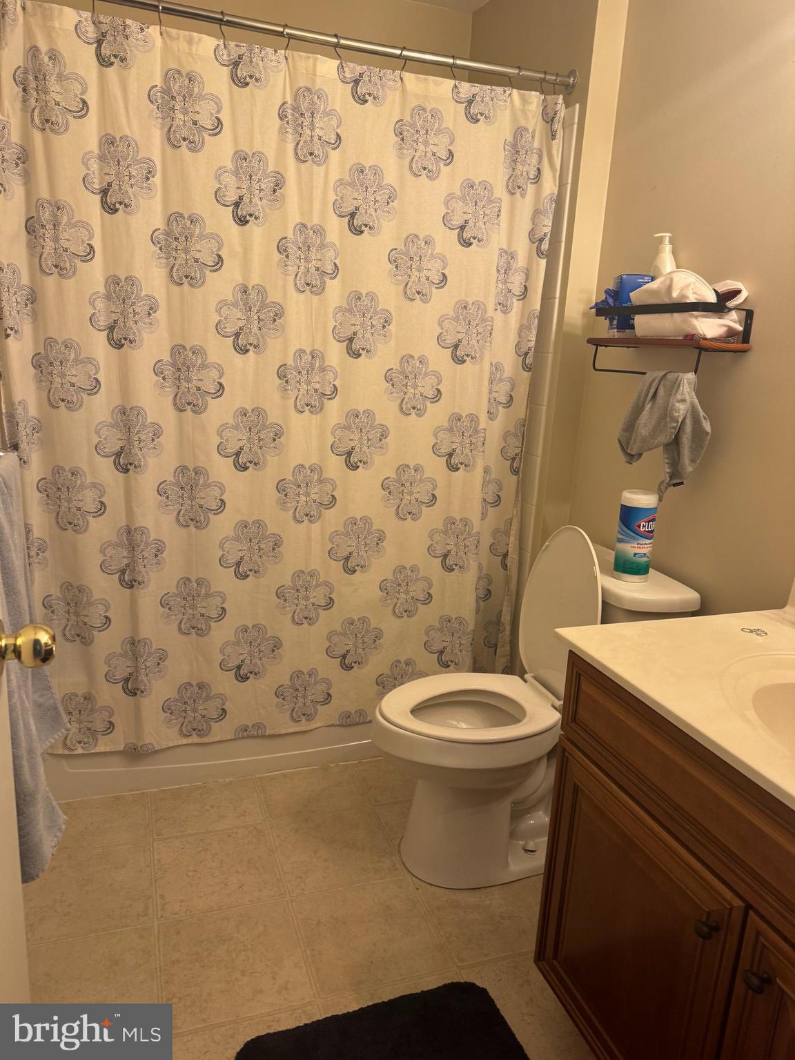 43 Poplar Street Glassboro, NJ 08028 - Photo 9 of 16 a bathroom with a toilet and a shower curtain