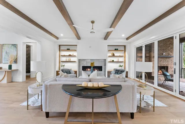 a kitchen with a stove a sink a dining table and chairs