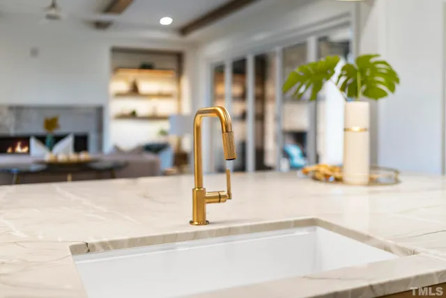 a bathroom sink with a granite countertop shower a sink and a granite counter top