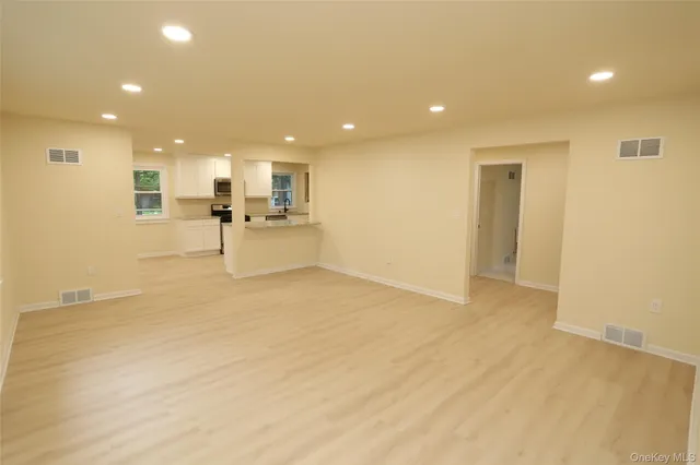 a view of a kitchen and a window