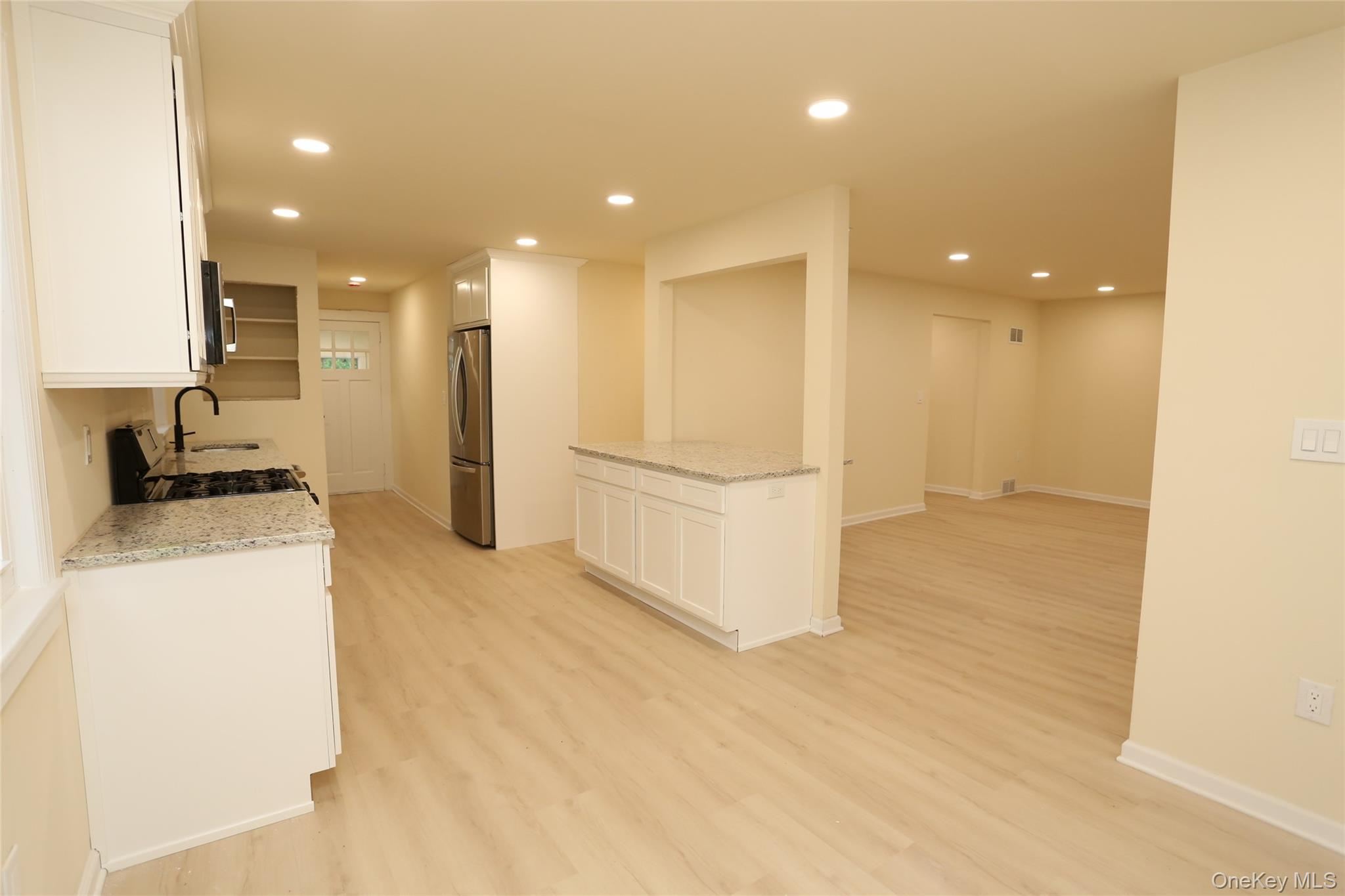 20 Pineview Road West Nyack, NY 10994 - Photo 5 of 36 a view of a kitchen with refrigerator and microwave