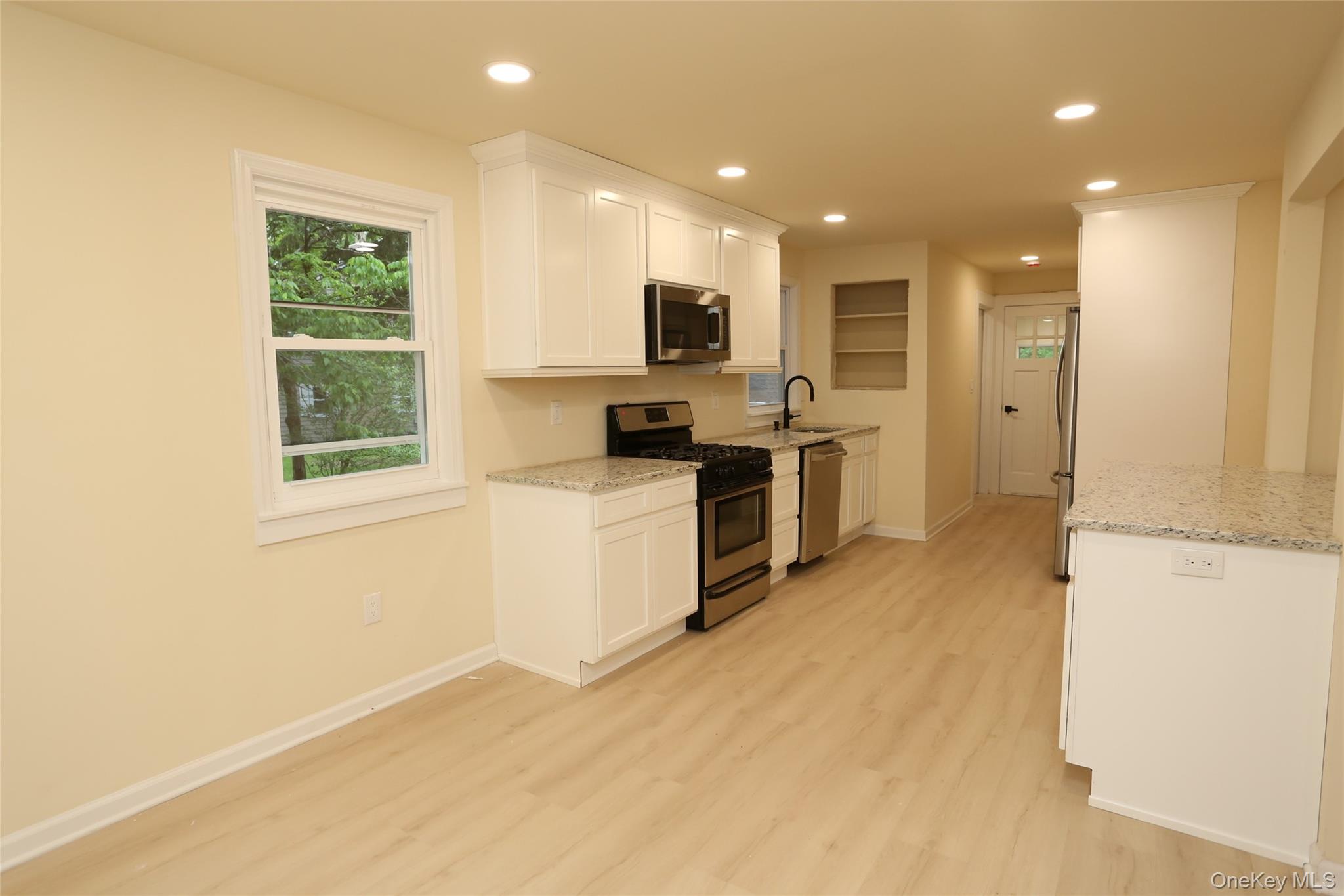 20 Pineview Road West Nyack, NY 10994 - Photo 10 of 36 a view of a kitchen with a sink a refrigerator and a stove