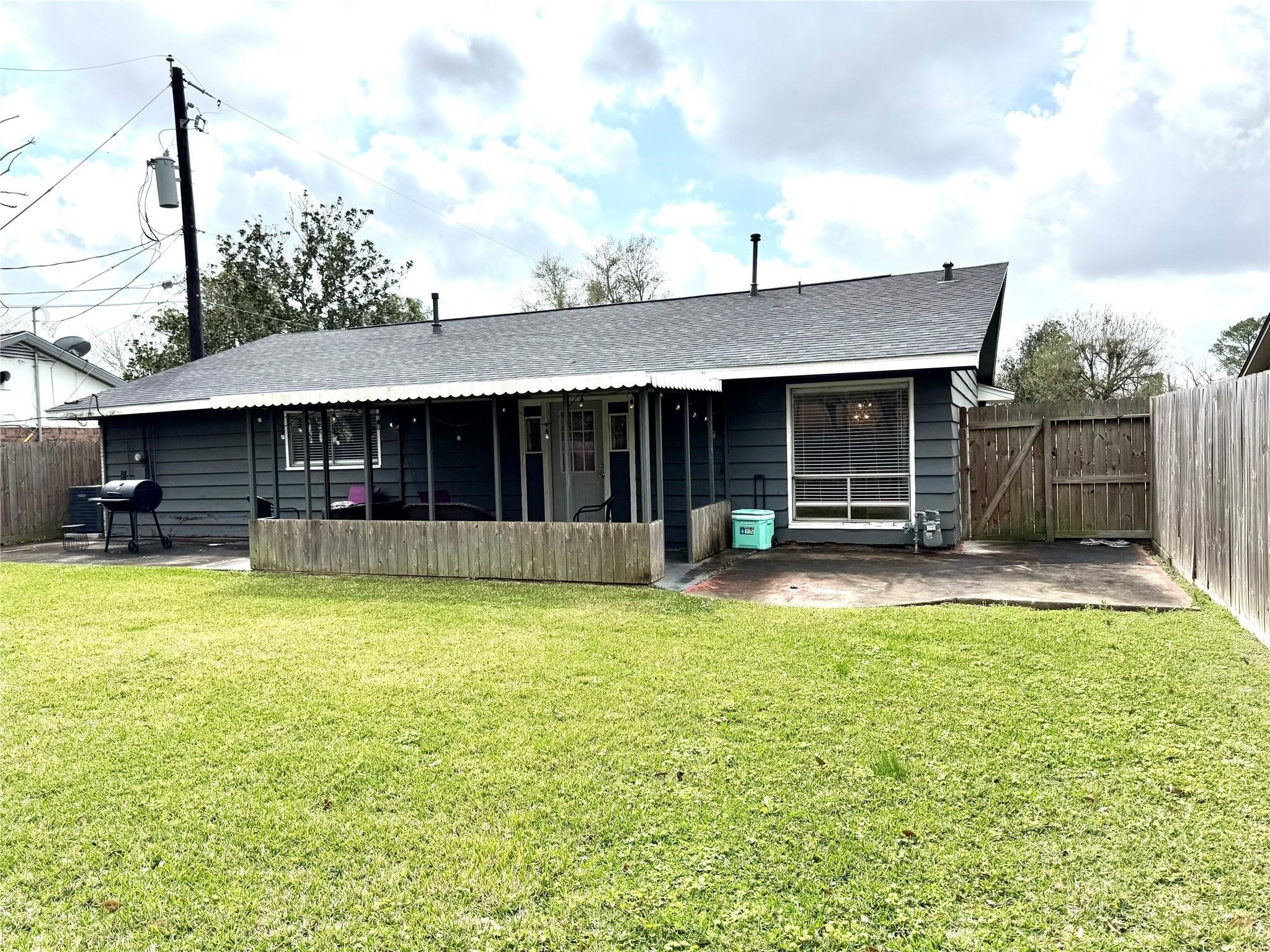 11311 Caribbean Lane Houston, TX 77089 - Photo 18 of 21 a view of a house with pool and a yard
