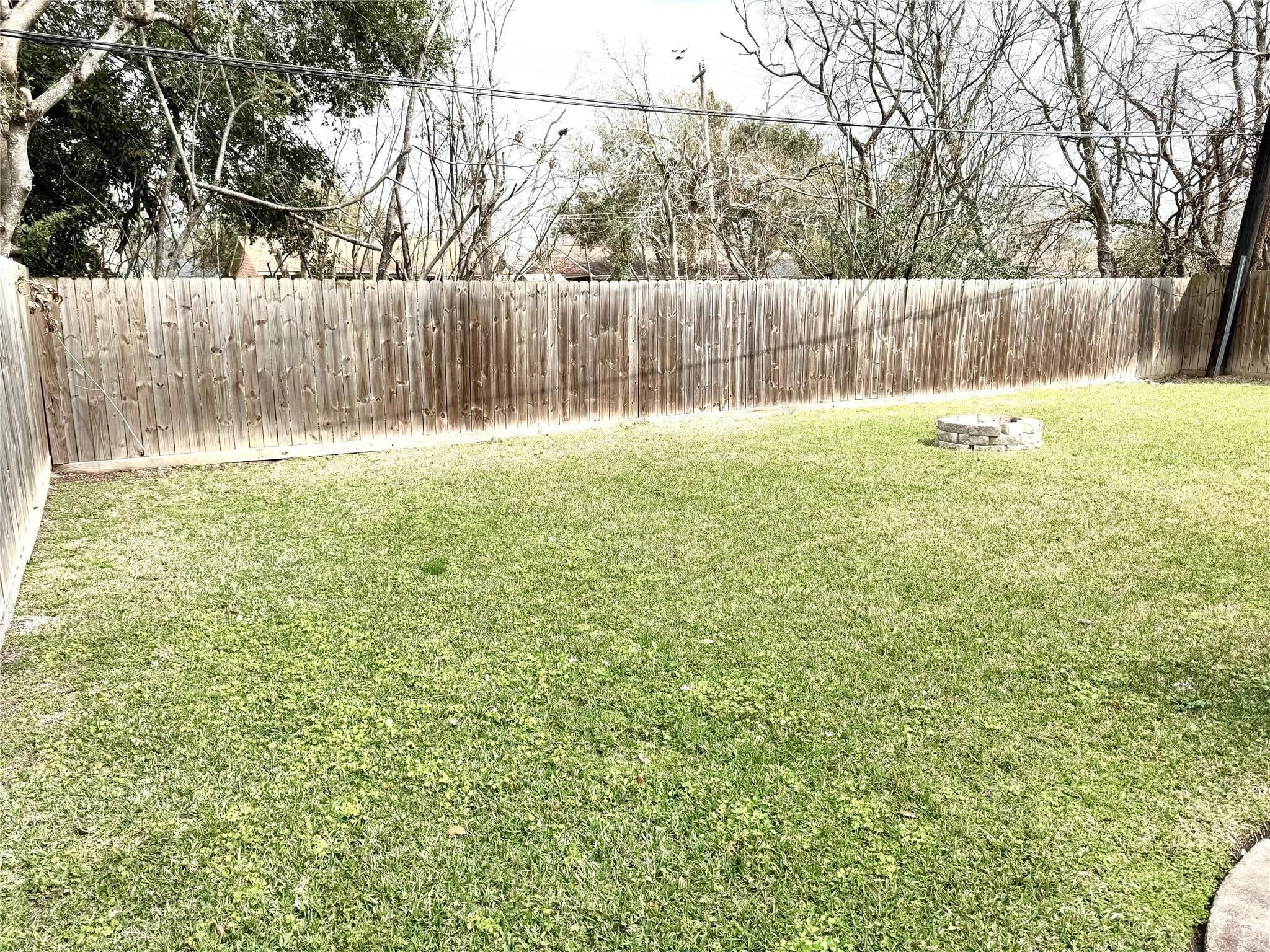 11311 Caribbean Lane Houston, TX 77089 - Photo 21 of 21 a view of yard with large trees and wooden fence