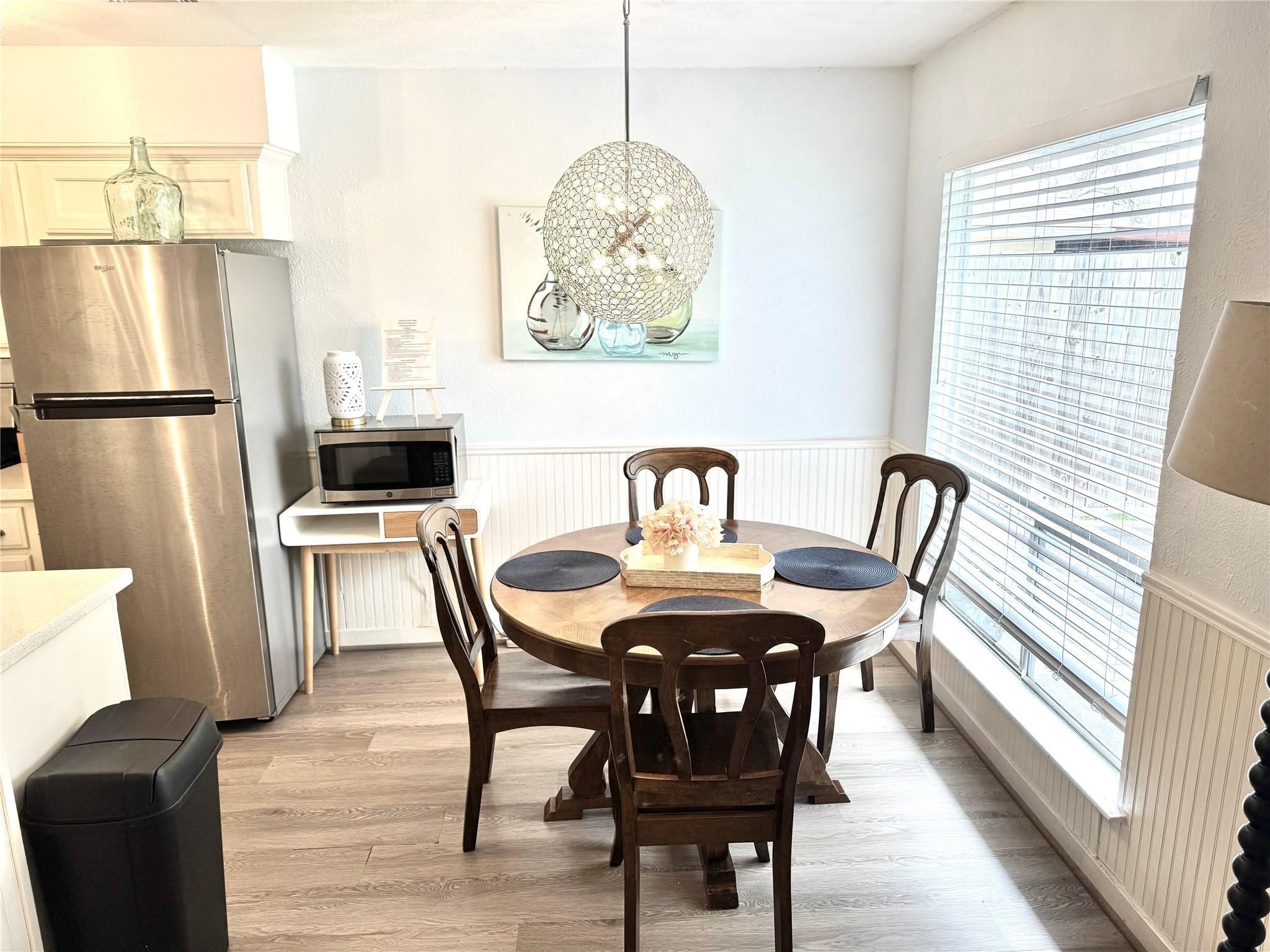 11311 Caribbean Lane Houston, TX 77089 - Photo 5 of 21 a view of a dining room with furniture and wooden floor
