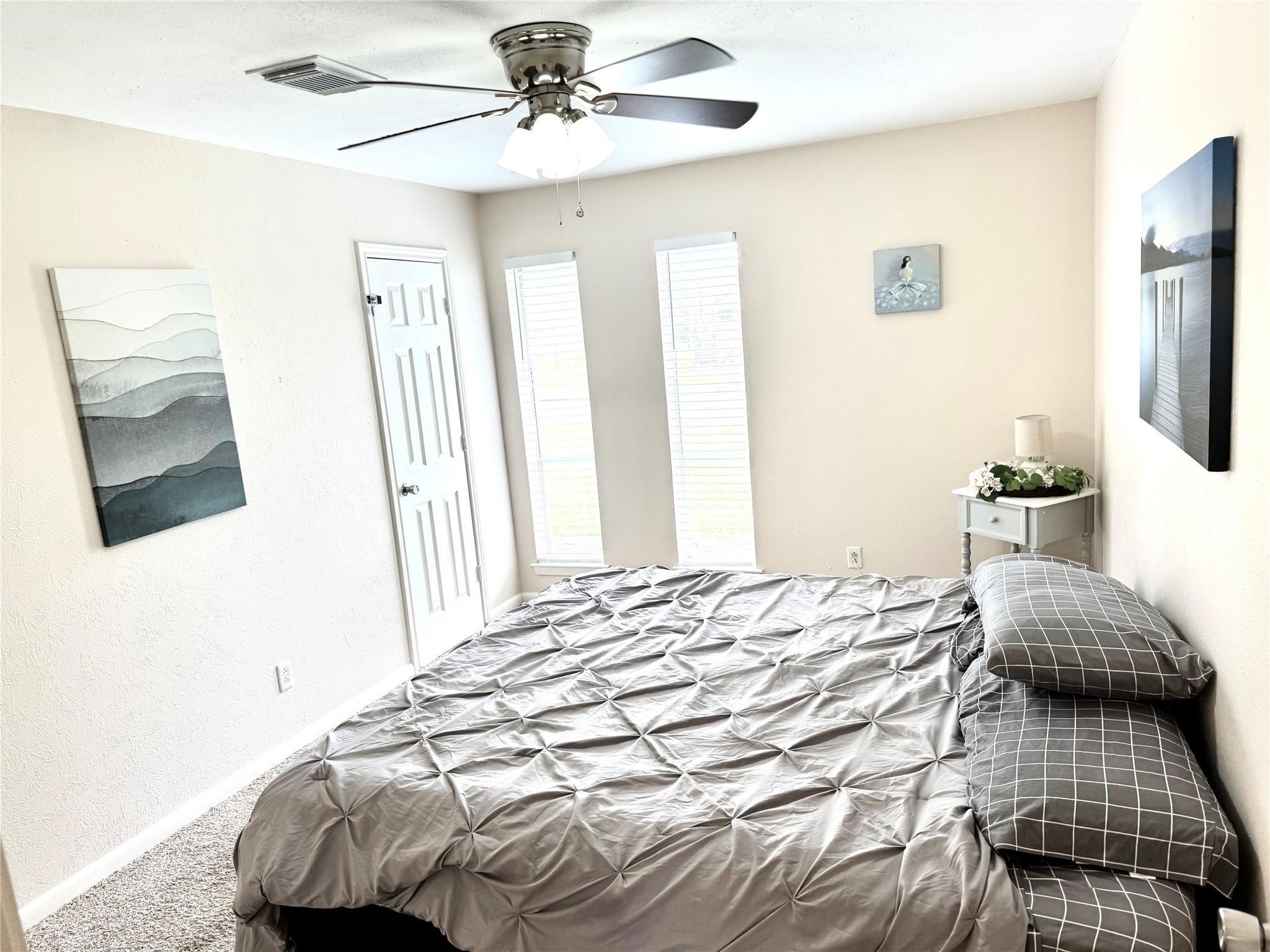 11311 Caribbean Lane Houston, TX 77089 - Photo 10 of 21 a bedroom with a bed and a flat screen tv