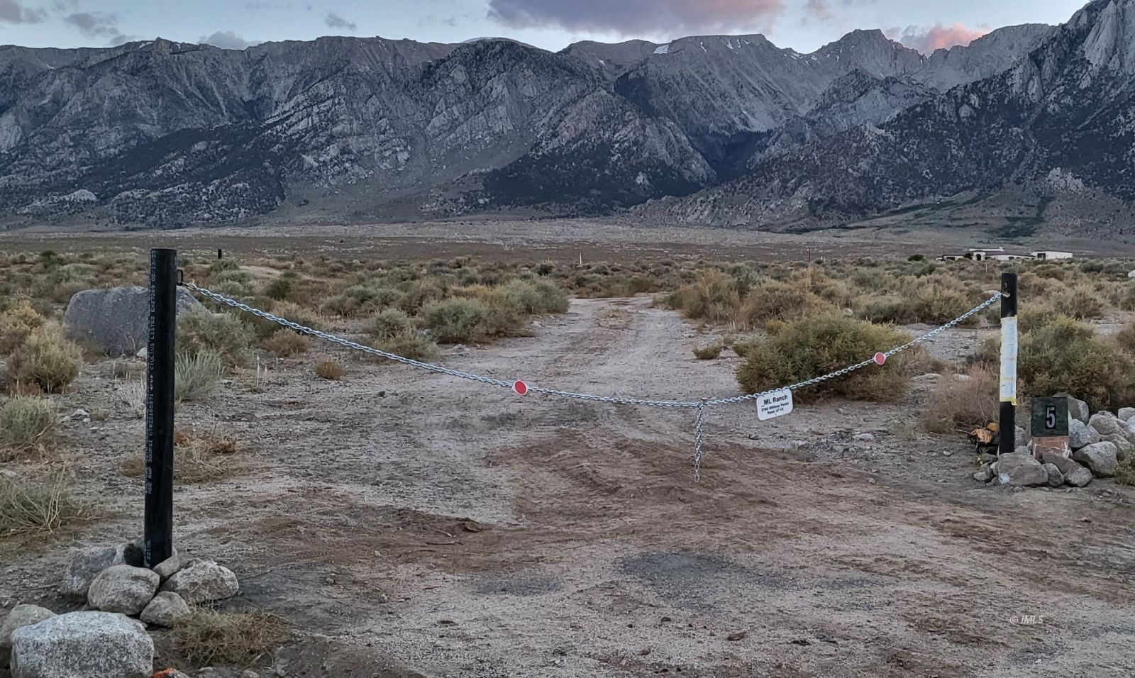 3760 Whitney Portal Road Lone Pine, CA 93545 - Photo 12 of 18 a view of a dry field with trees in the background
