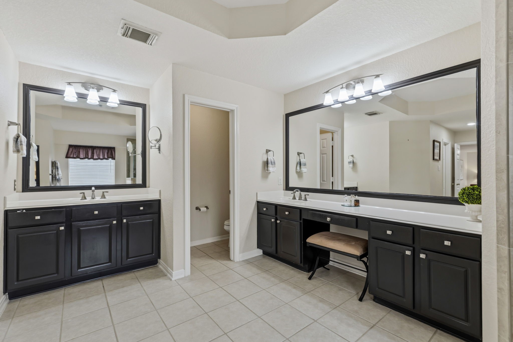 20102 Windbury Court Spring, TX 77379 - Photo 21 of 49 a spacious bathroom with a granite countertop sink and a mirror