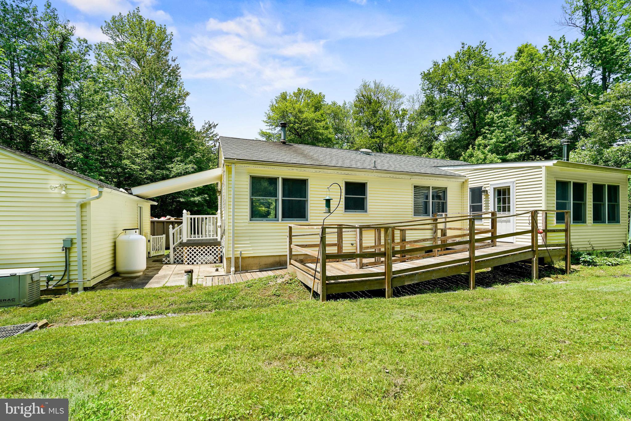 2940 Old Elk Neck Road Elkton, MD 21921 - Photo 5 of 24 a view of a house with backyard and chairs