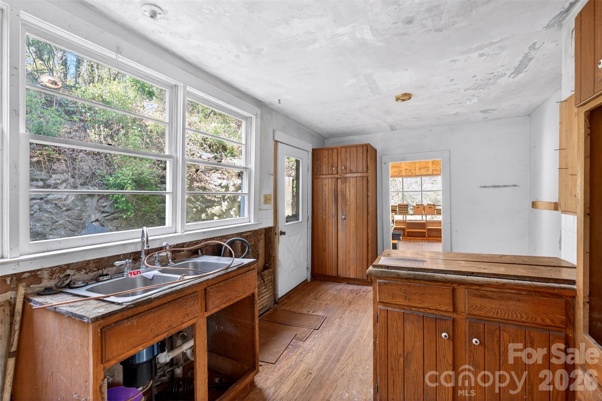 105 Poplar Street Saluda, NC 28773 - Photo 13 of 37 a kitchen with a sink stove and microwave