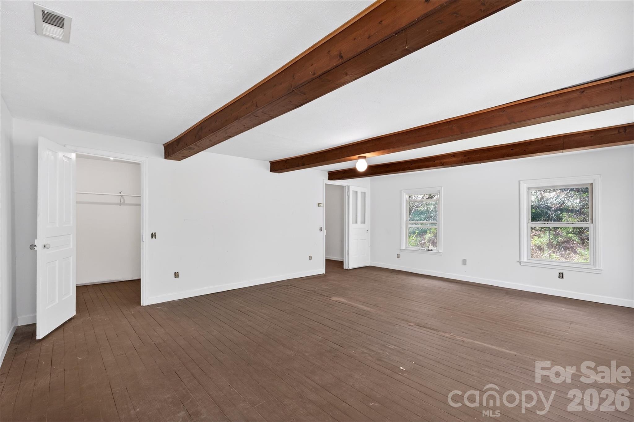 105 Poplar Street Saluda, NC 28773 - Photo 20 of 37 a view of an empty room with windows