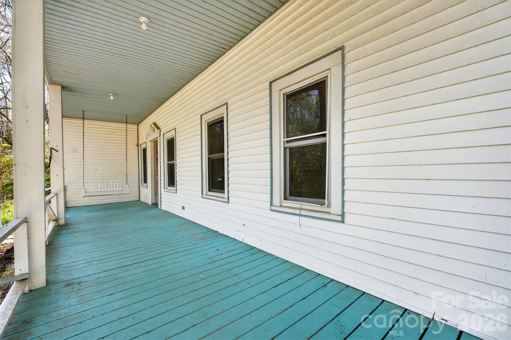 105 Poplar Street Saluda, NC 28773 - Photo 2 of 37 a view of front door and deck of the house