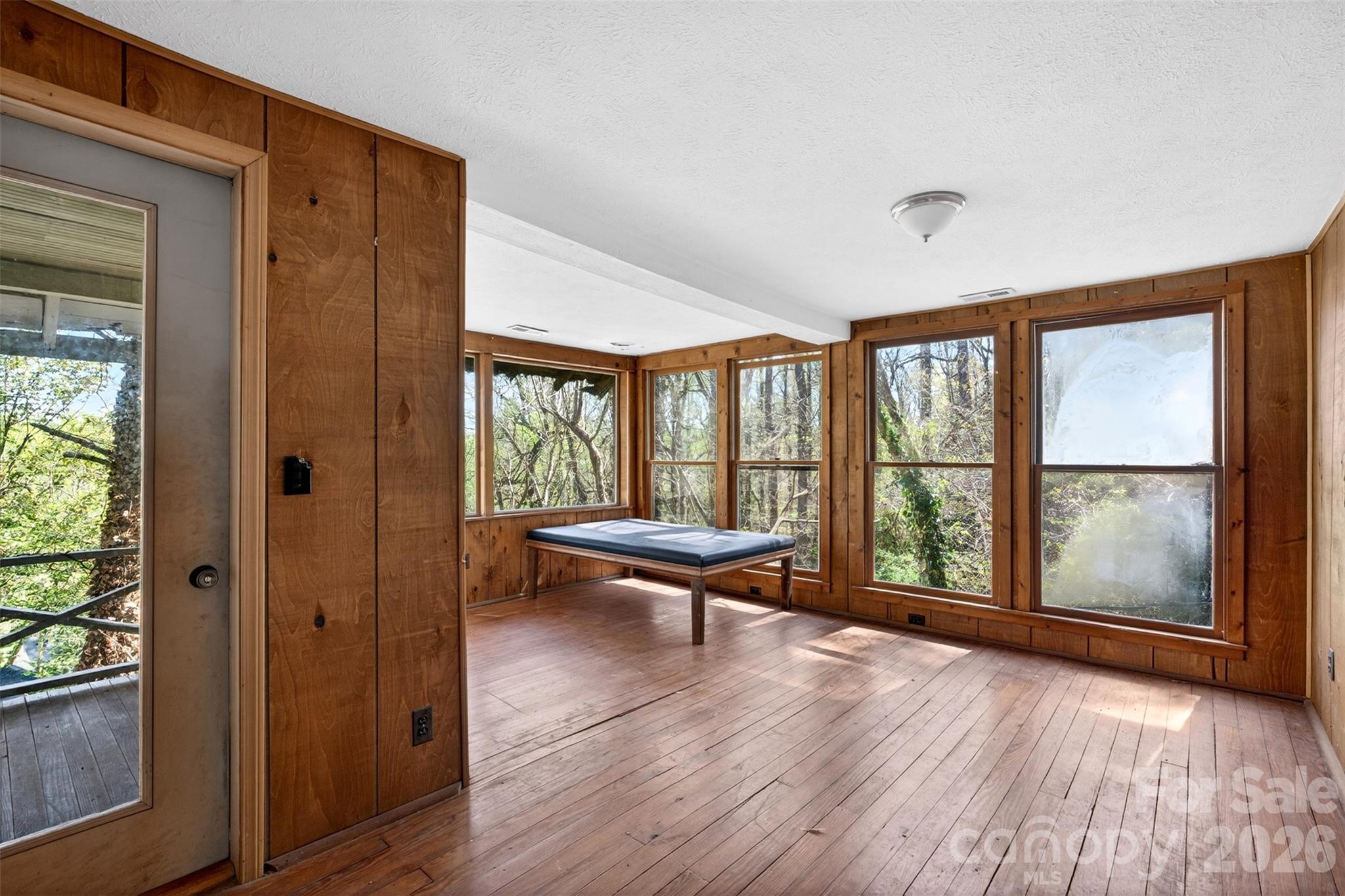 105 Poplar Street Saluda, NC 28773 - Photo 27 of 37 a bathroom with a large window and wooden floor