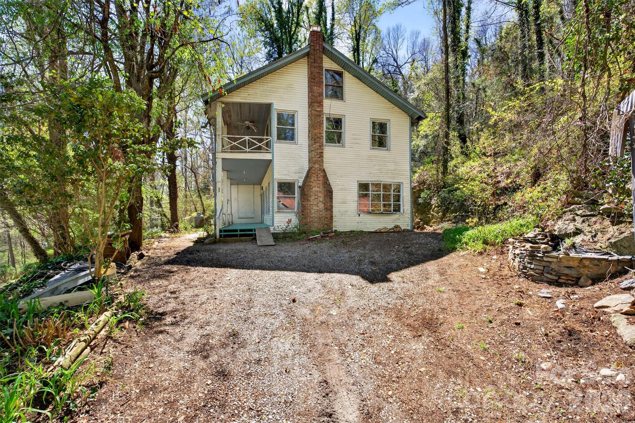 105 Poplar Street Saluda, NC 28773 - Photo 28 of 37 a view of a house with a yard