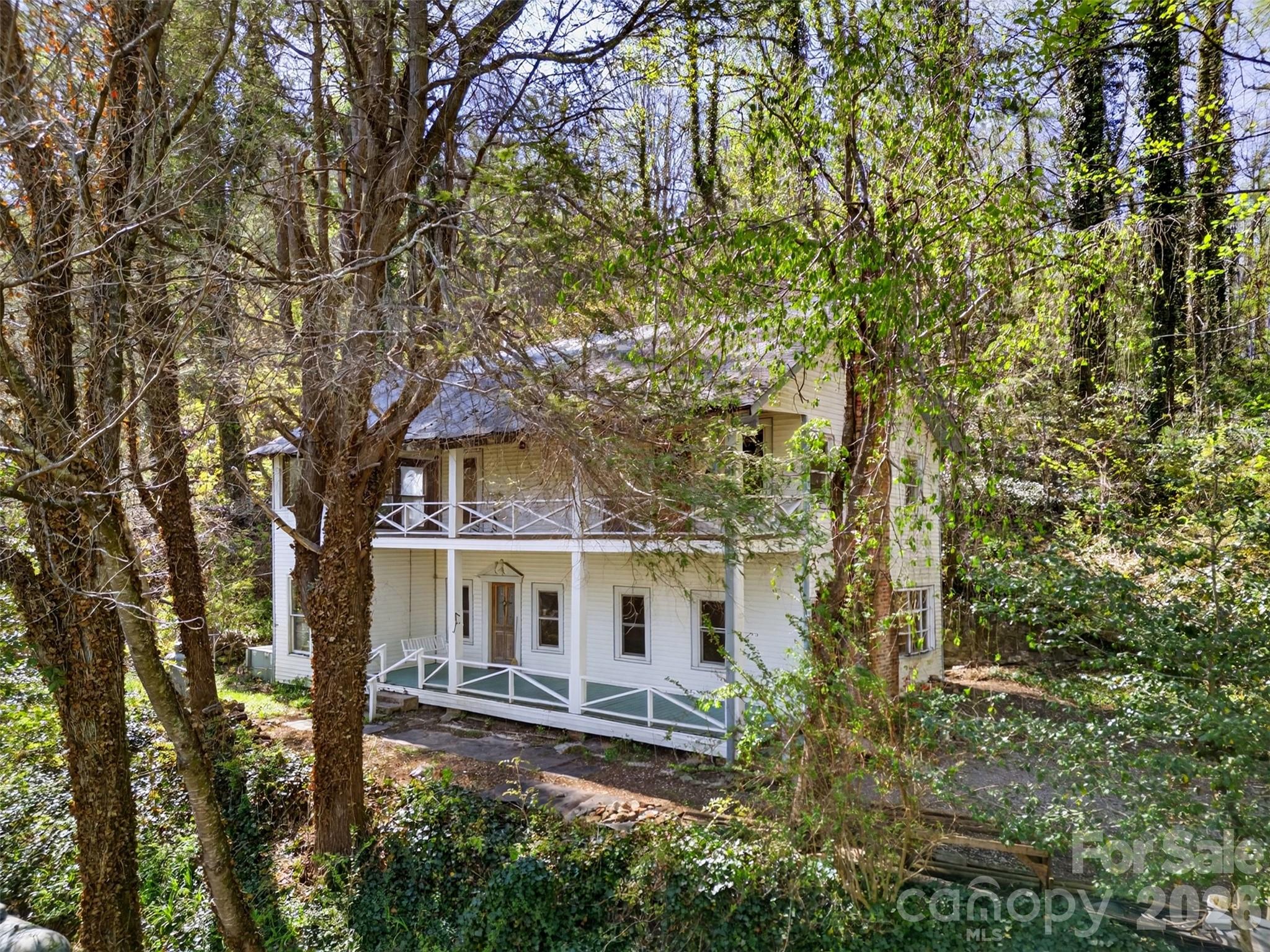 105 Poplar Street Saluda, NC 28773 - Photo 35 of 37 front view of a house with a yard