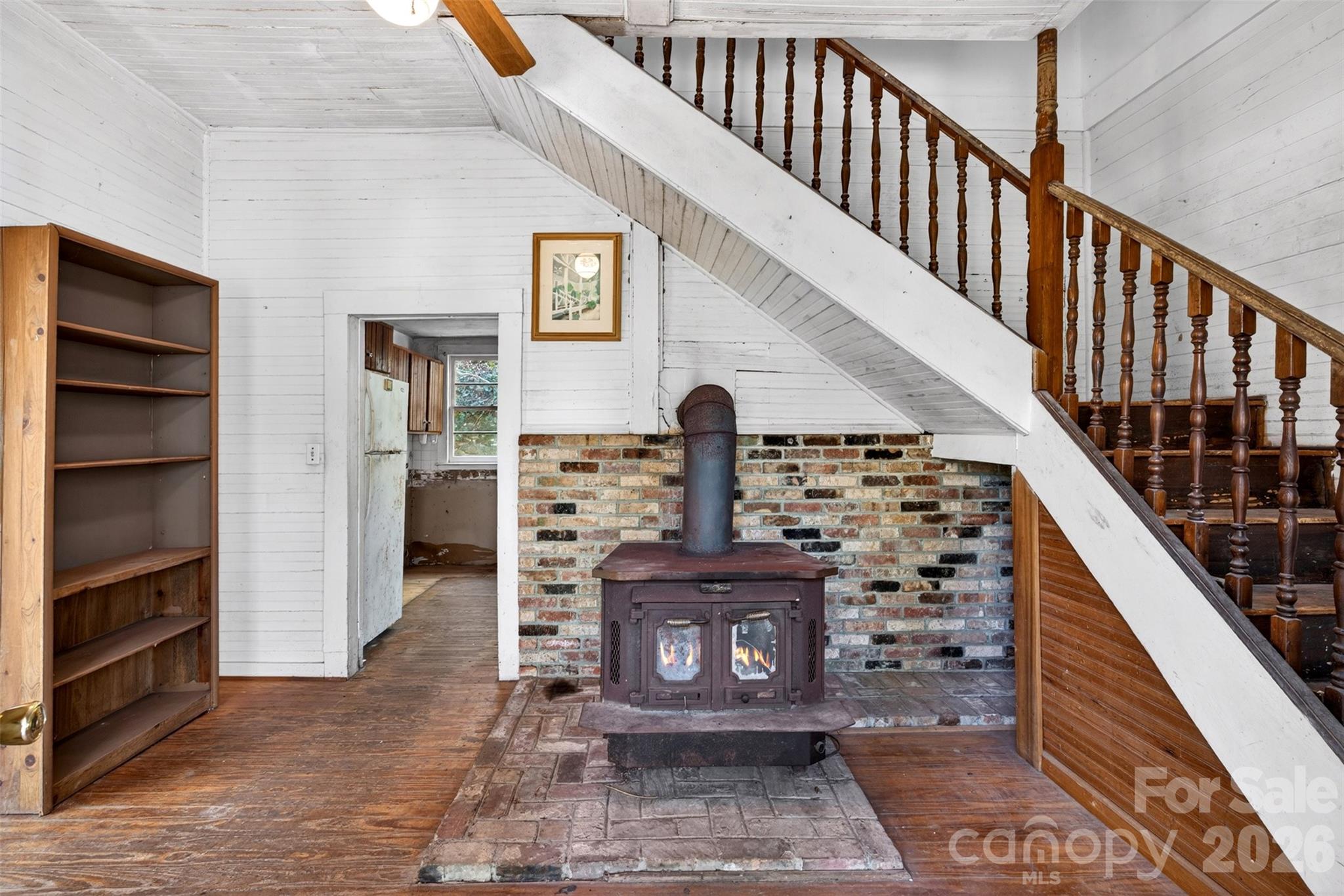 105 Poplar Street Saluda, NC 28773 - Photo 4 of 37 a view of staircase with fireplace