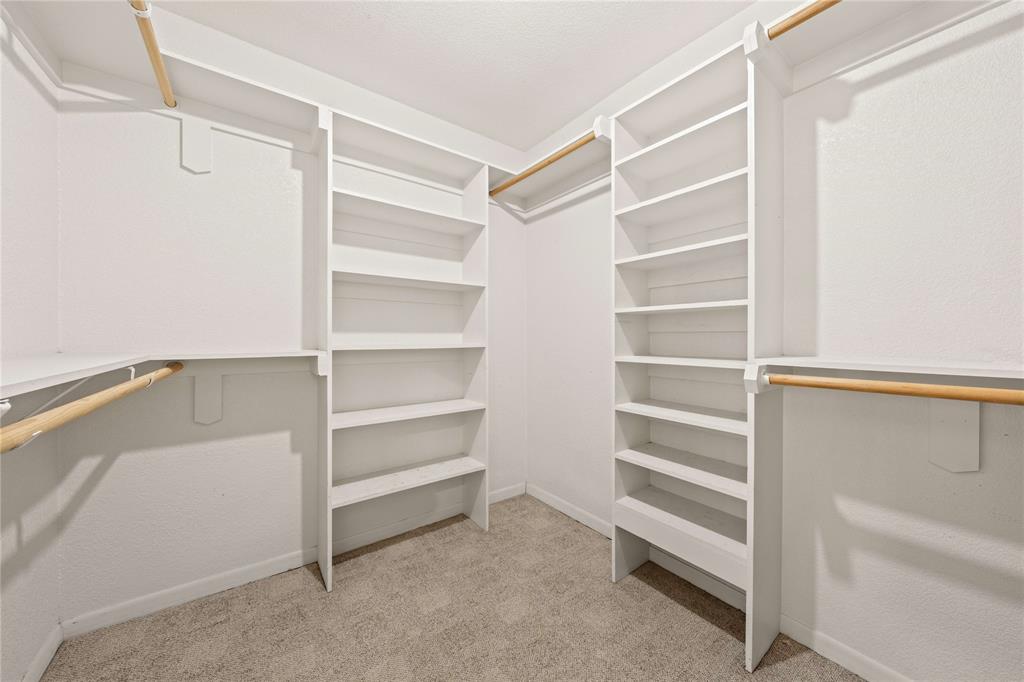 919 North 11th Street Temple, TX 76501 - Photo 21 of 26 a view of walk in closet with empty racks