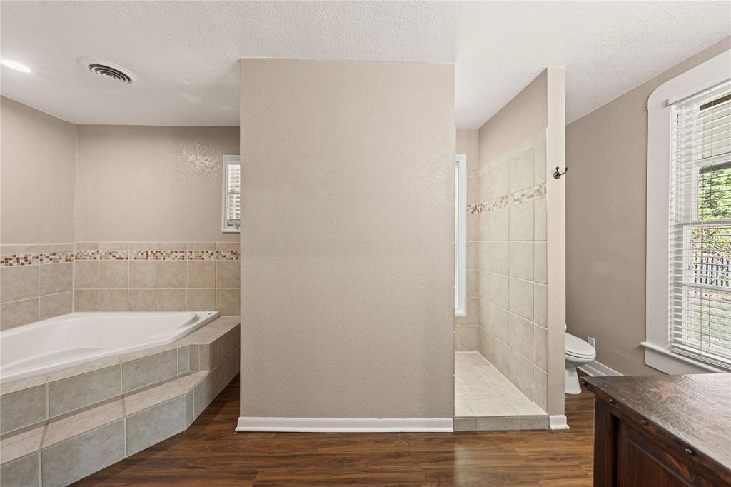 919 North 11th Street Temple, TX 76501 - Photo 22 of 26 a bathroom with a tub and shower