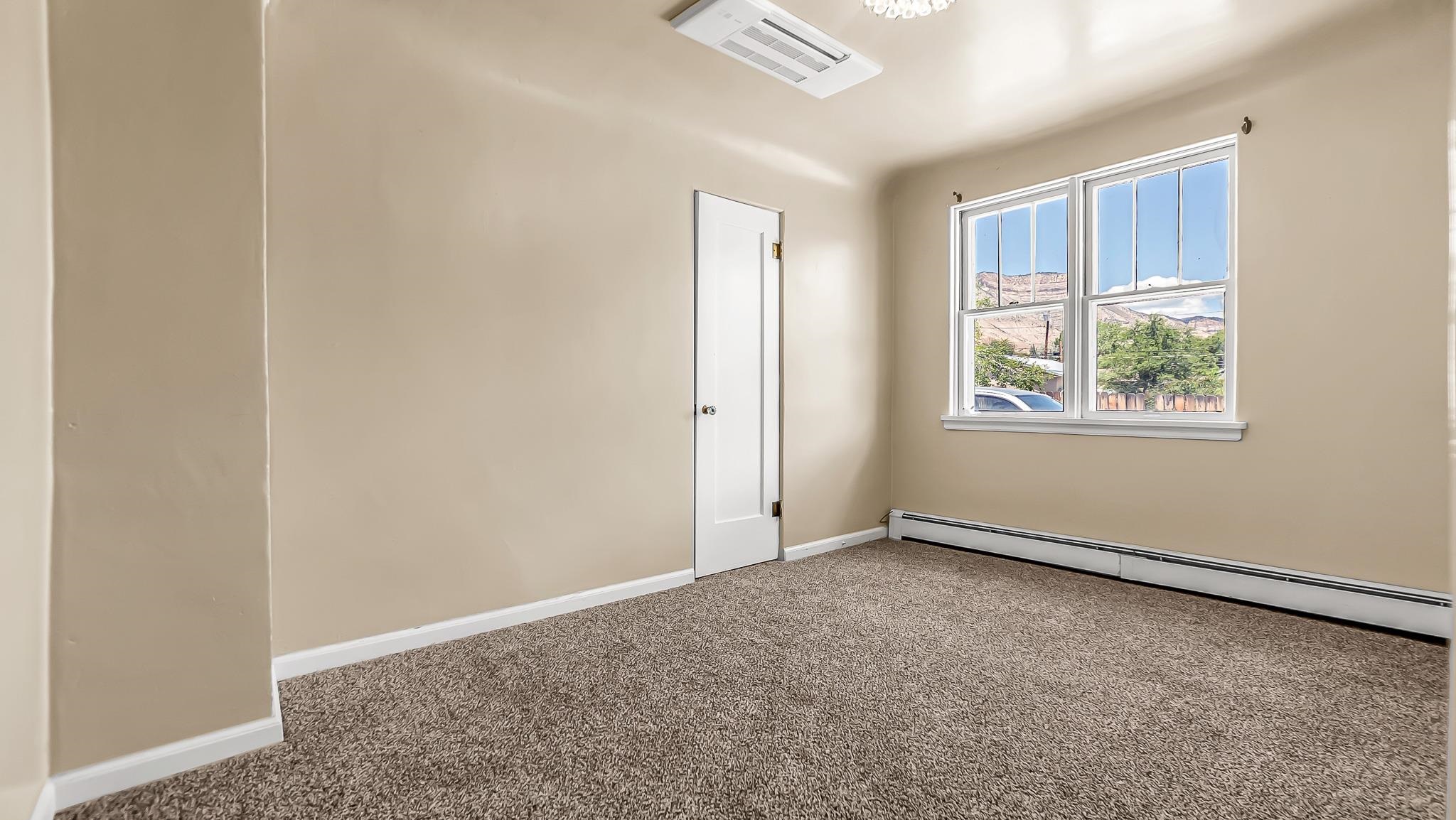 208 3rd Street Parachute, CO 81635 - Photo 11 of 40 an empty room with windows