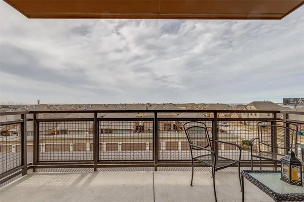 a view of a balcony dining area