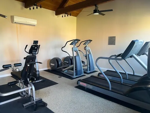 a view of yard with swimming pool and seating