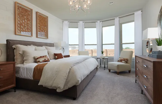 a bed room with a bed and a couch