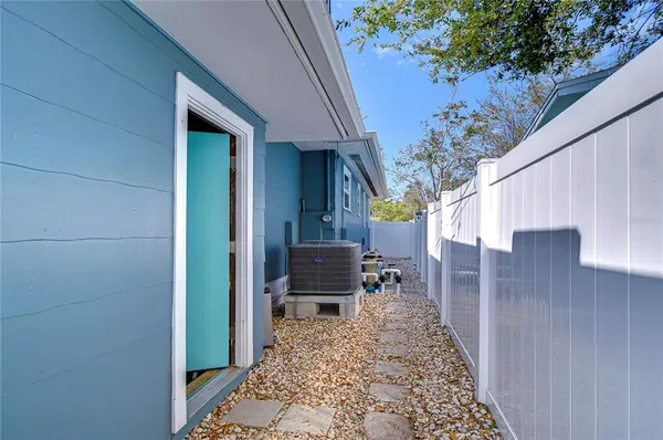 a view of a patio with a table and chairs