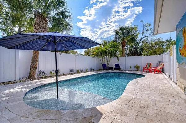 a view of a backyard with a tub