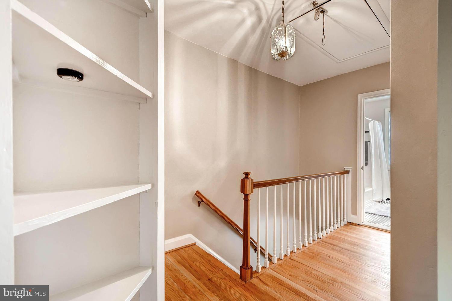 1817 Glen Ridge Road Parkville, MD 21286 - Photo 23 of 30 custom built-in shelving, pull down attic stairs