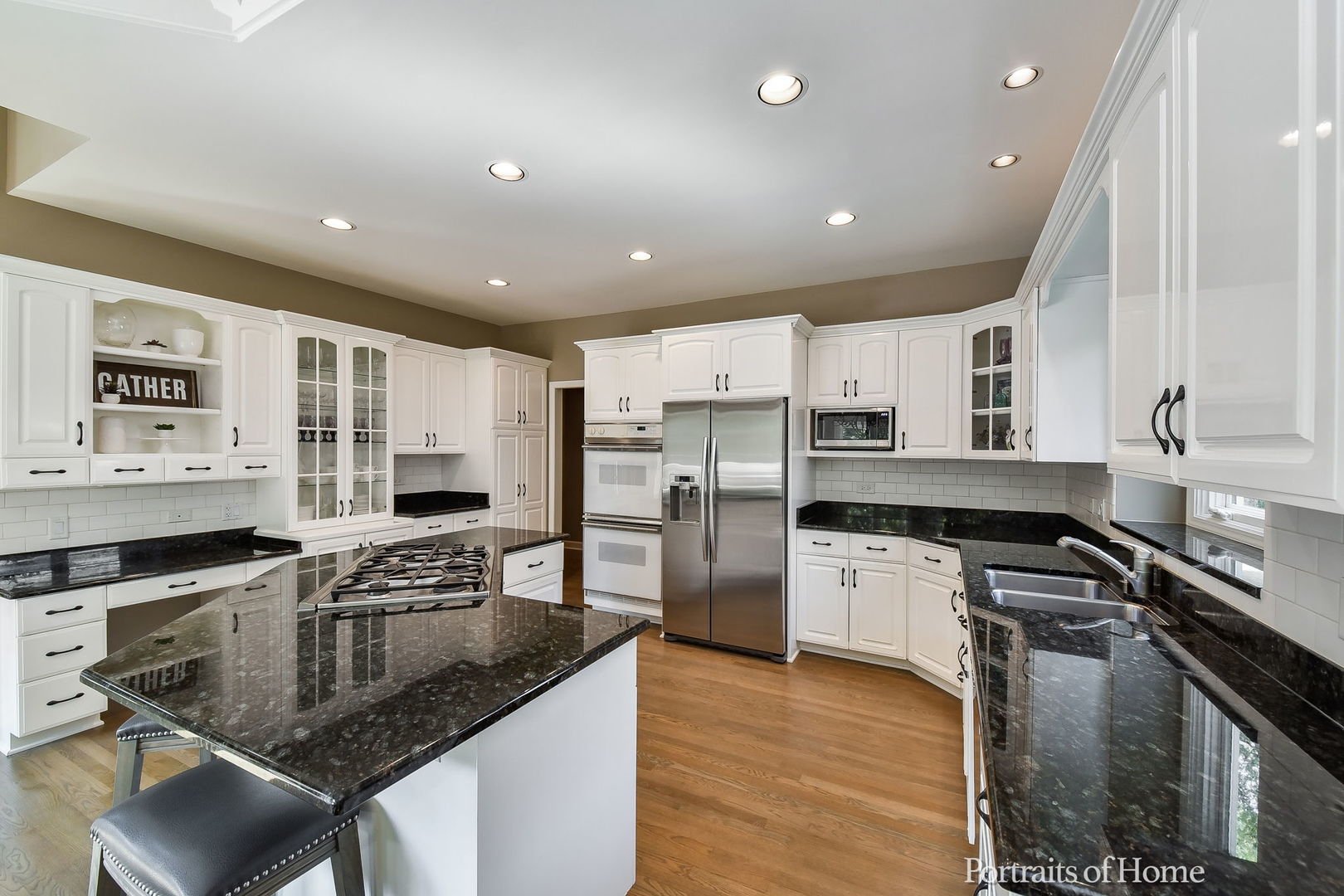 674 East Gartner Road Naperville, IL 60540 - Photo 13 of 36 a kitchen with stainless steel appliances granite countertop a sink stove and refrigerator