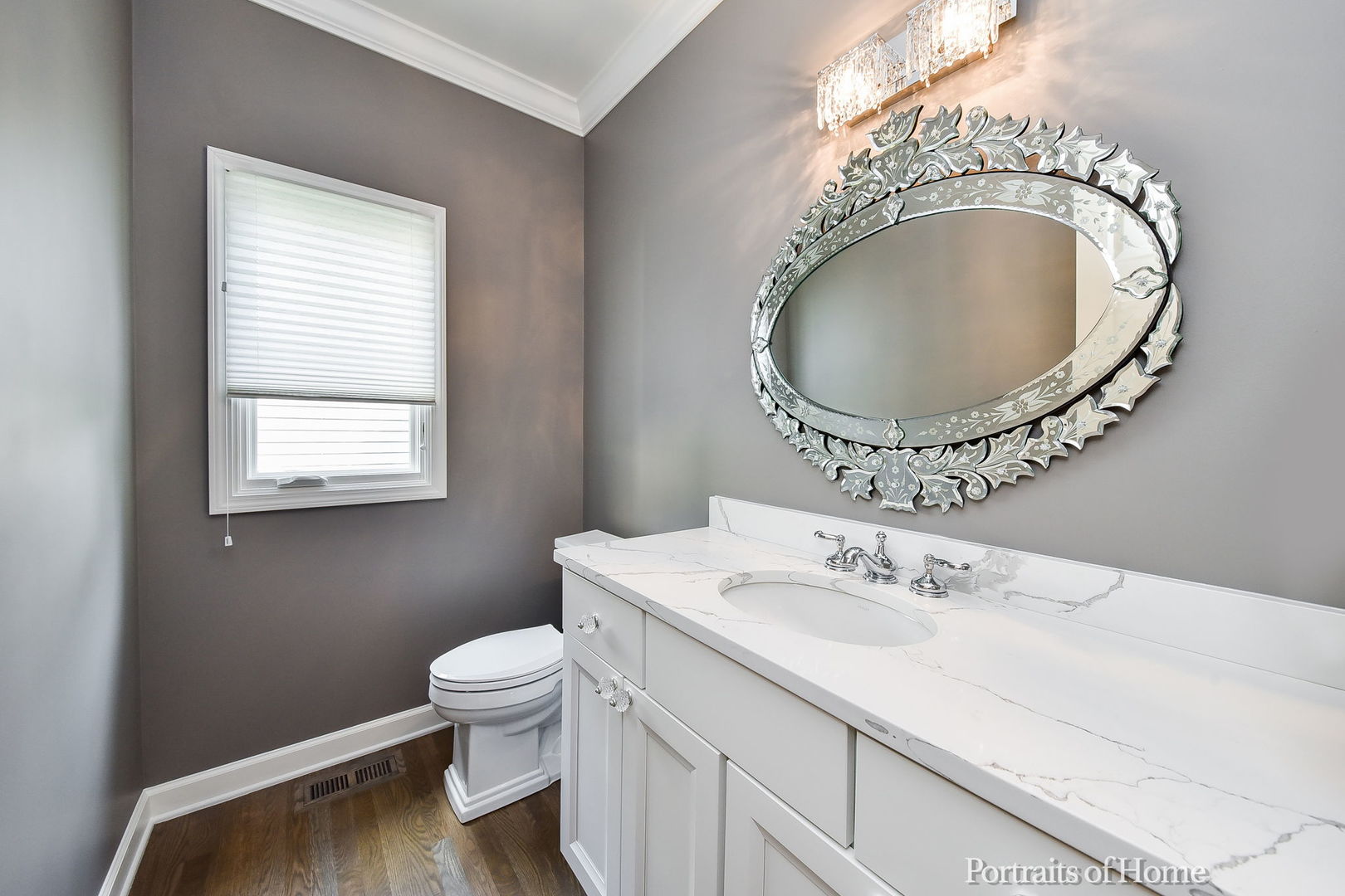 674 East Gartner Road Naperville, IL 60540 - Photo 16 of 36 a bathroom with a granite countertop toilet a sink and a mirror