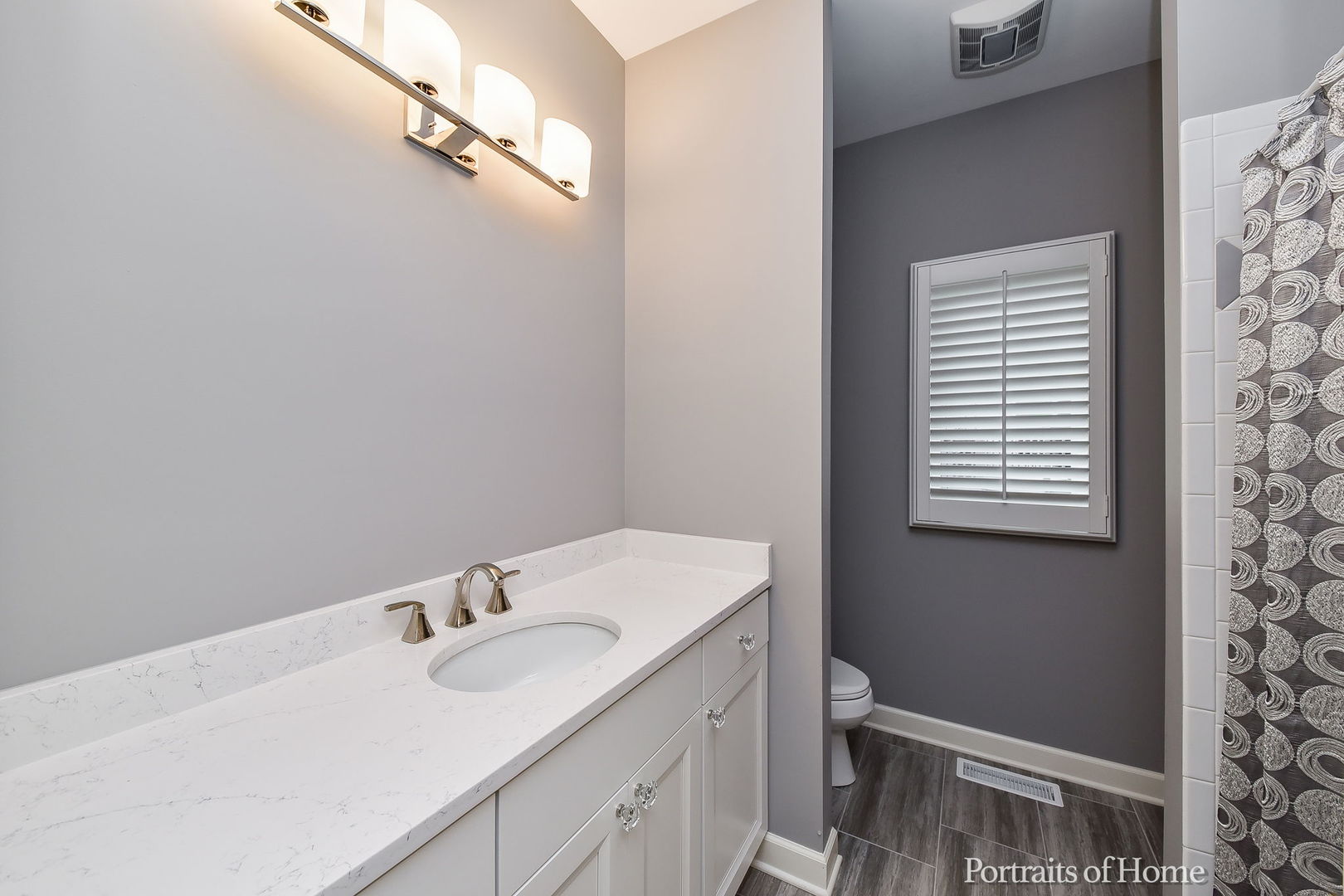 674 East Gartner Road Naperville, IL 60540 - Photo 21 of 36 a bathroom with a sink and a vanity