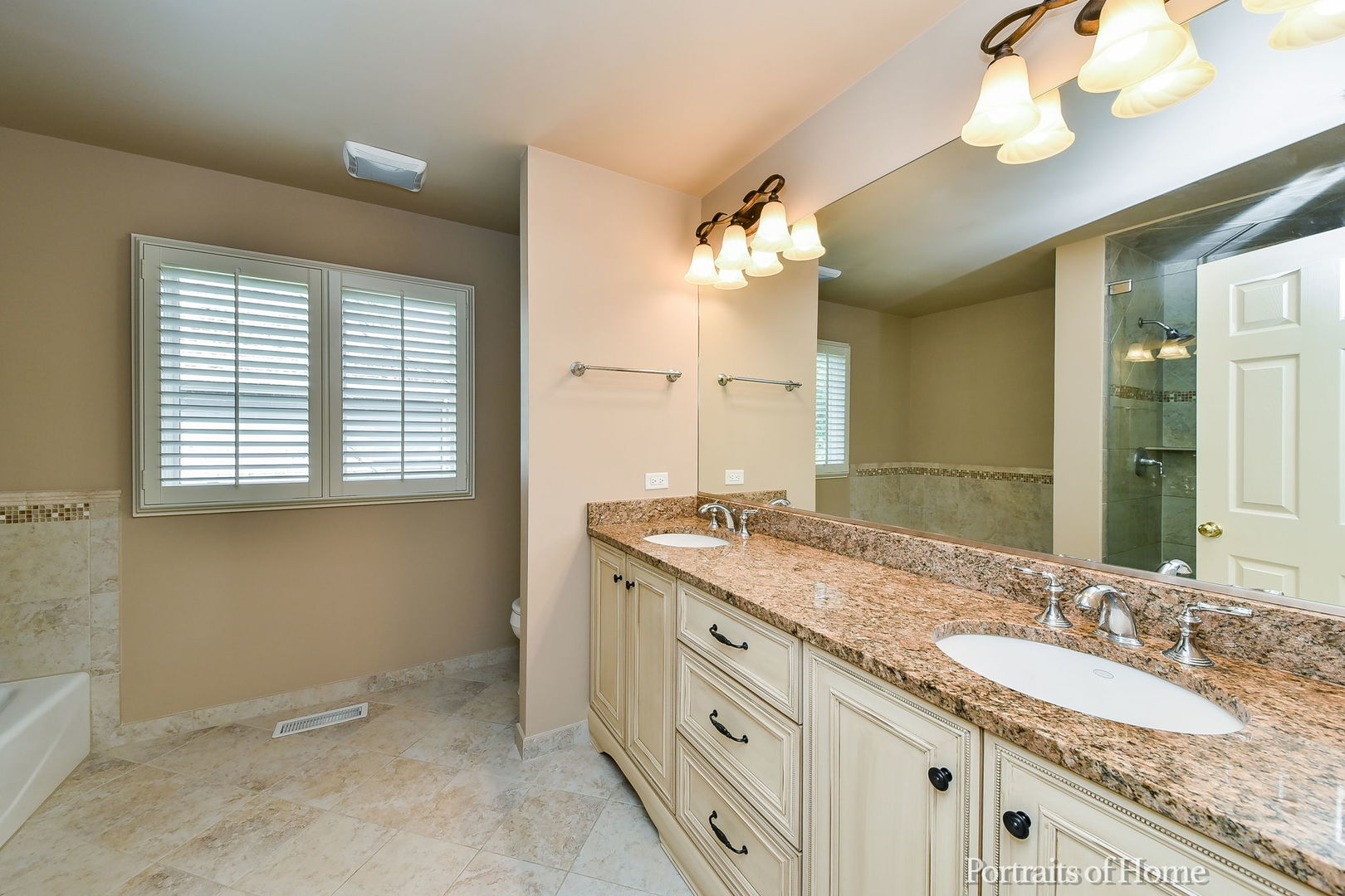 674 East Gartner Road Naperville, IL 60540 - Photo 23 of 36 a bathroom with a granite countertop double vanity sink and a mirror