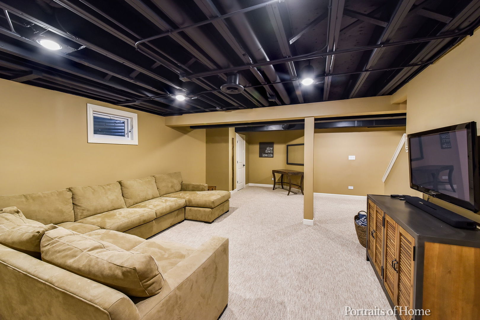 674 East Gartner Road Naperville, IL 60540 - Photo 29 of 36 a living room with furniture and a flat screen tv