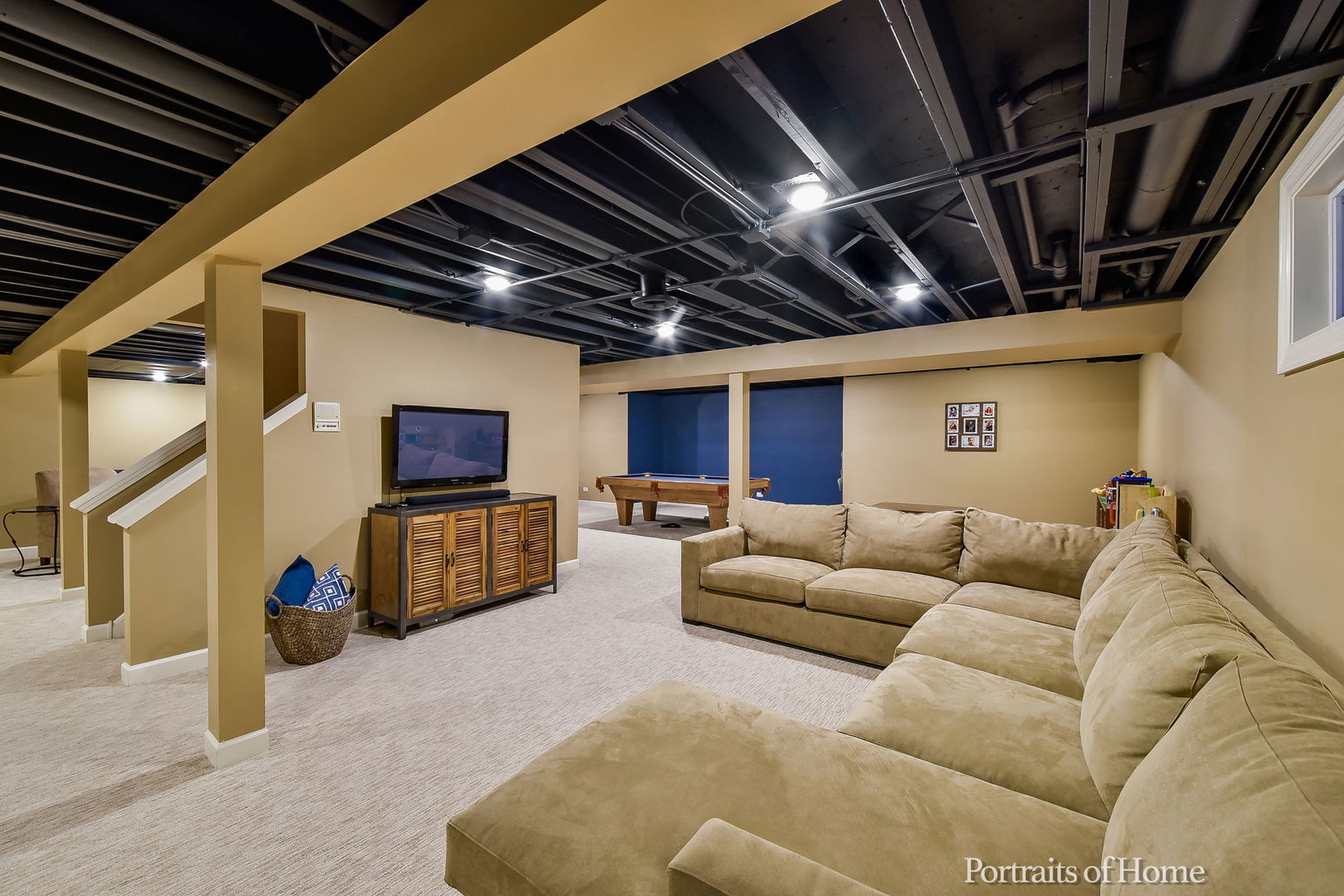 674 East Gartner Road Naperville, IL 60540 - Photo 30 of 36 a living room with furniture a flat screen tv and a couch