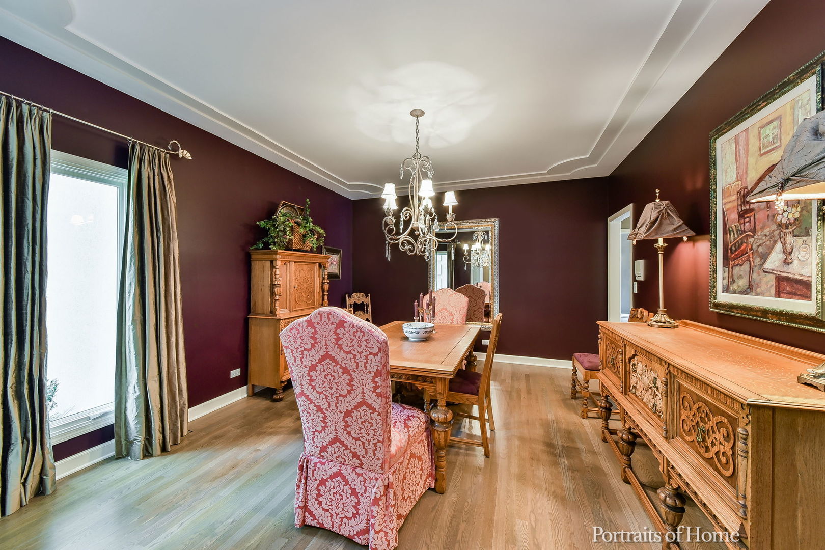 674 East Gartner Road Naperville, IL 60540 - Photo 4 of 36 a dining room with furniture a chandelier and wooden floor