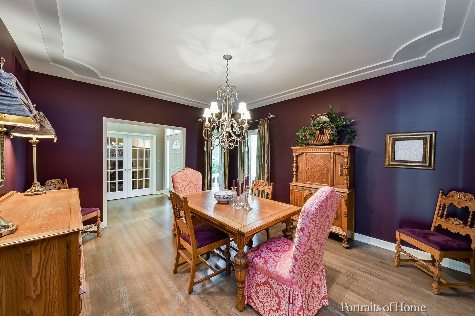 674 East Gartner Road Naperville, IL 60540 - Photo 5 of 36 a dining room with furniture a chandelier and wooden floor
