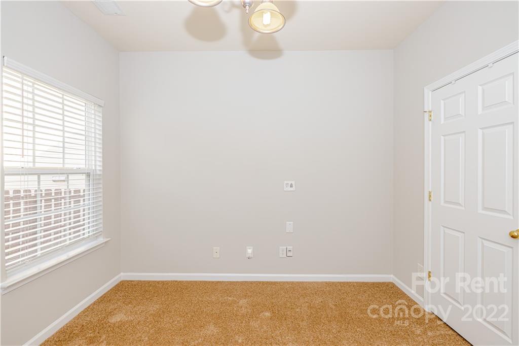 3329 Burnage Hall Road Harrisburg, NC 28075 - Photo 12 of 47 an empty room with windows
