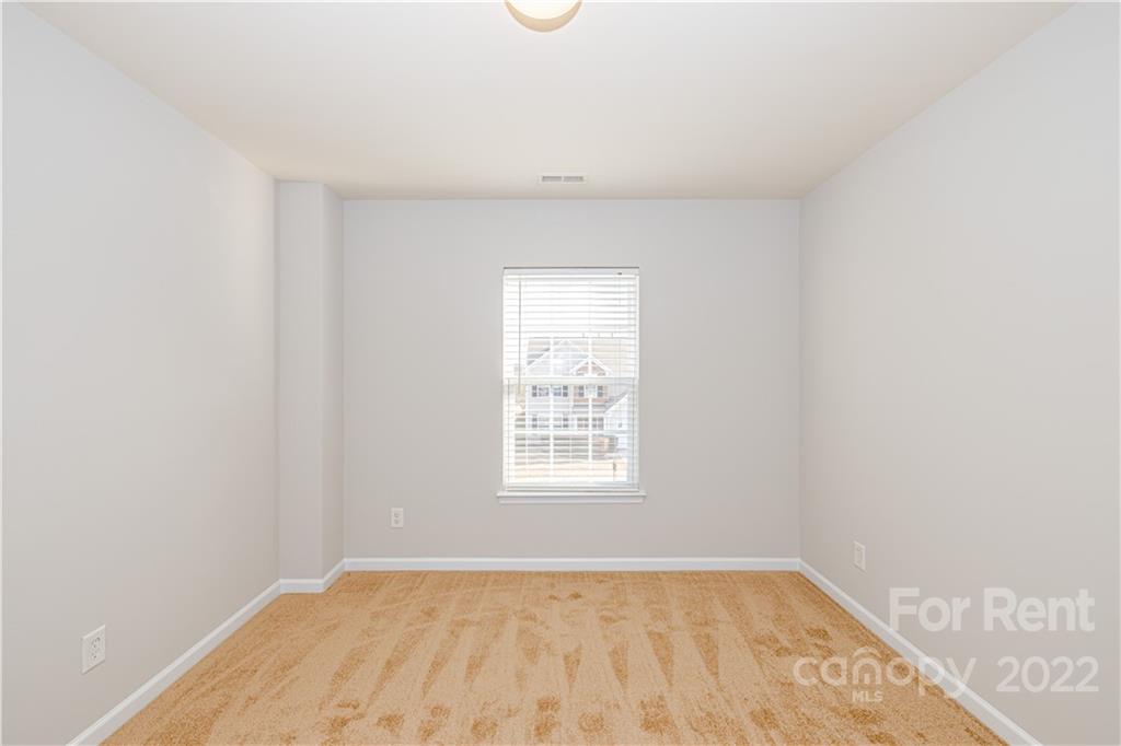 3329 Burnage Hall Road Harrisburg, NC 28075 - Photo 22 of 47 a view of an empty room with a window