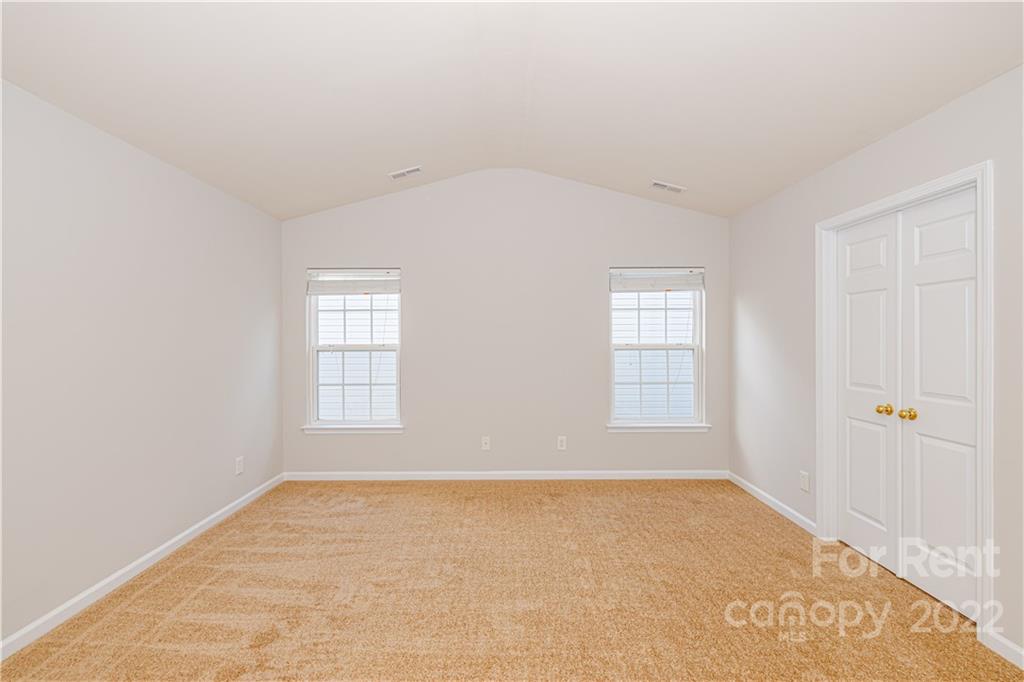 3329 Burnage Hall Road Harrisburg, NC 28075 - Photo 23 of 47 an empty room with windows