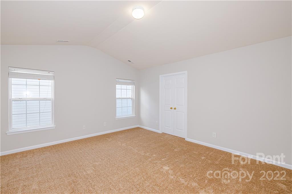 3329 Burnage Hall Road Harrisburg, NC 28075 - Photo 24 of 47 an empty room with windows